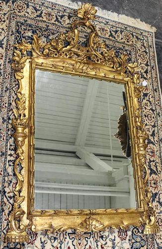 An Italian Giltwood Mirror. Length overall 50 1/2 inches.