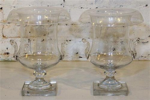 * A Pair of Glass Urns. Height 12 inches.