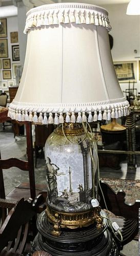 A Reverse Painted Glass Lamp. Height 34 1/2 inches.
