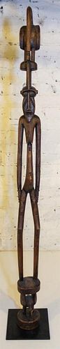 * A Senufo Style Female Figure Height overall 55 inches.