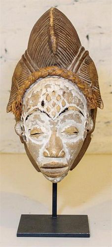 * A Baule Style Painted Mask. Height overall 14 inches.