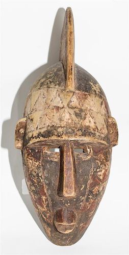 * A Mossi Painted Helmet Mask. Height 21 inches.