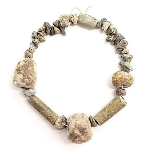 * An Egyptian Stone Necklace. Length overall 13 1/2 inches.