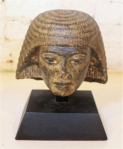 * An Egyptian Style Cast Stone Bust. Height 6 1/2 inches.