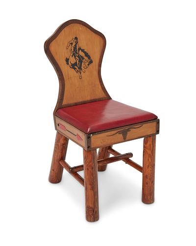 A Wyoming Furniture Co. keyhole chair with bucking bronco