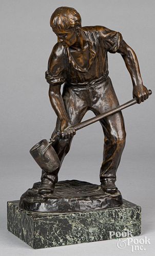 Bronze of a metal worker