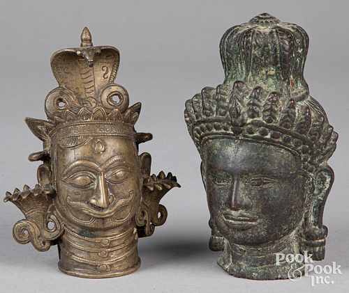 Two Chinese or Southeast Asian bronze Buddha heads