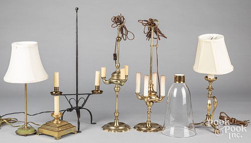Six brass and iron table lamps.