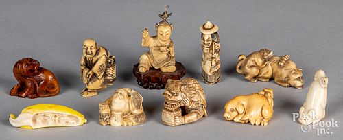Ten Japanese carved bone figures and netsuke.