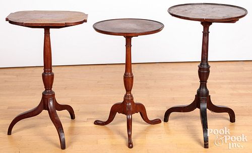 Three walnut and mahogany candlestands, ca. 1800.