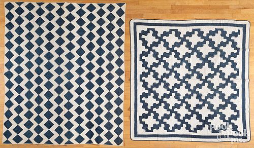 Two blue and white quilts.