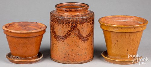Redware crock and two flowerpots