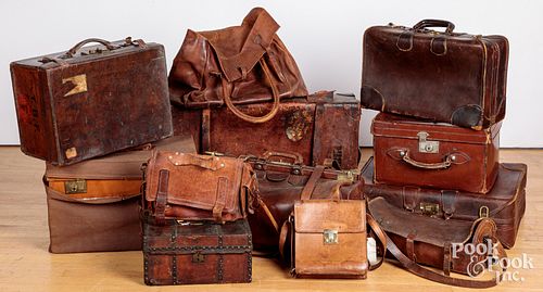Group of vintage leather travel bags and suitcases