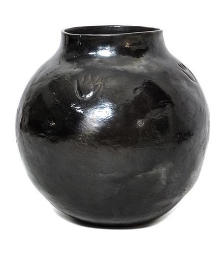 A Santa Clara Blackware Jar Height 18 x diameter 16 1/2 inches.