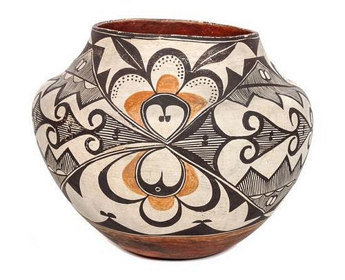 An Acoma Polychrome Olla Height 10 x diameter 12 inches.