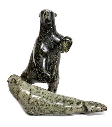 Two Inuit Carved Soapstone Figures Height of the first: 9 7/8 inches.