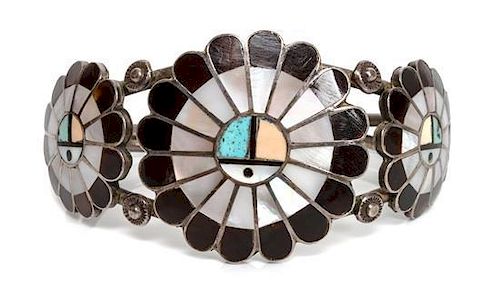 A Zuni Sun Face Bracelet Length 5 1/2 x opening 1 x width 2 3/8 inches.