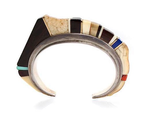 A Hopi Silver, Wood, Lapis, Coral, and 18 Karat Yellow Gold Bracelet, Charles Loloma (1921-1991) Length 5 x opening 1 x width 3/