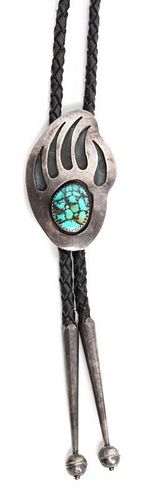A Navajo Silver and Turquoise Bolo, E. King Height 2 1/4 x width 1 3/8 inches.