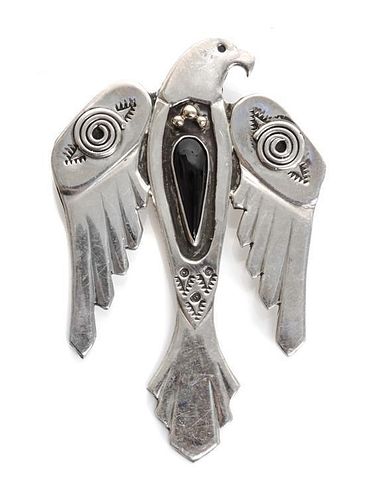 A Navajo Silver, Onyx and 14 Karat Gold Thunderbird Pin Height 3 inches.