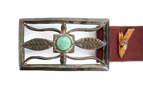 A Navajo Silver Sand Cast and Turquoise Belt Buckle Height 2 1/4 x width 4 inches.