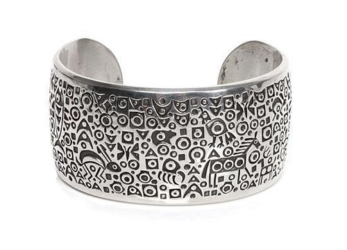 A Navajo Silver Cuff Bracelet, Norbert Peshlakai Length 5 5/8 x opening 1 x width 1 1/4 inches.