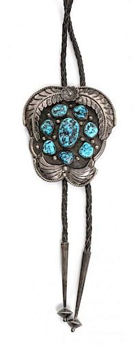 A Navajo Silver and Turquoise Bolo Height 3 1/2 x width 3 inches.