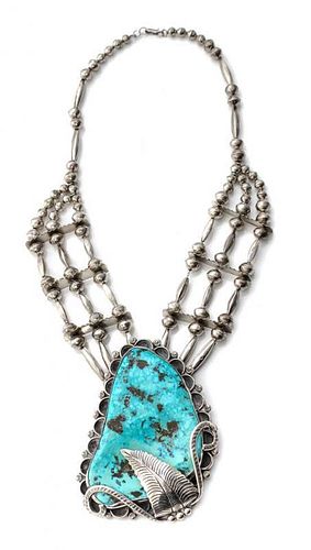 A Monumental Southwestern Silver and Turquoise Pendant on Silver Bead Chain Height 4 3/4 x width 3 1/2 inches.