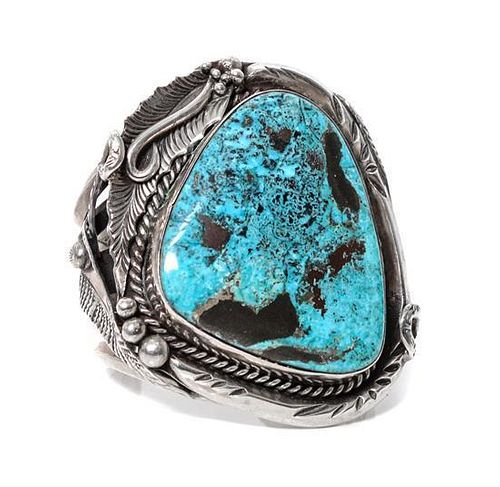 A Monumental Southwestern Silver and Turquoise Bracelet Length 5 3/4 x opening 1 x width 3 1/4 inches.