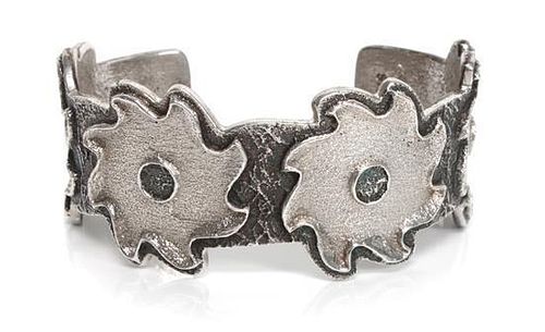 A Silver Sand Cast Bracelet, Monty Claw Length 5 7/8 x opening 1 1/8 x width 1 1/8 inches.