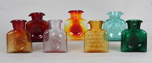Seven Blenko colored glass water bottles