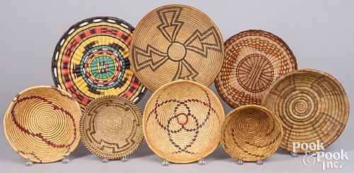 Eight Native American Indian coiled baskets