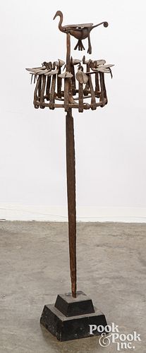 African iron sculpture of birds atop incised blade