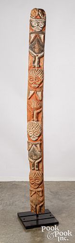 Tribal totem pole with human figures