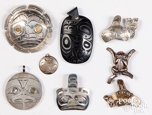 Group of Haida Indian brooches and pendants