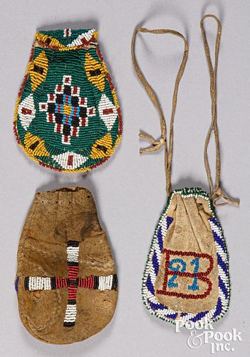Three Apache Indian beaded hide pouches