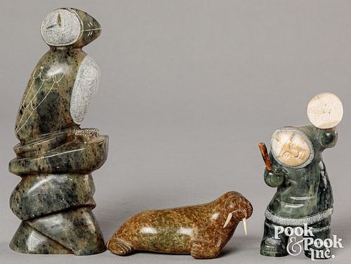Three Inuit carved stone figures