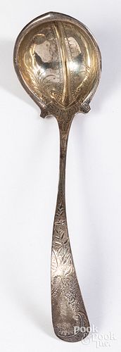 Sterling silver ladle retailed by J.E. Caldwell