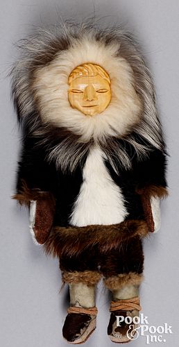 Inuit doll with carved wood face