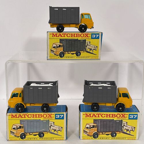 Three Boxed Matchbox 37 Cattle Trucks, All die cast metal, yellow cabs, grey plastic boxes, green tinted windows, metal baseplates, two white plastic 