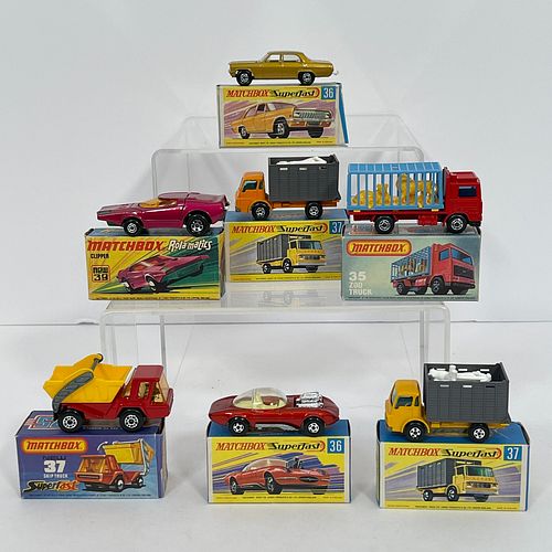 Group Of Eight Matchbox Superfast Vehicles, Including 35 Zoo Truck, red cab and chassis, black base, blue plastic cage with yellow plastic lions, blac