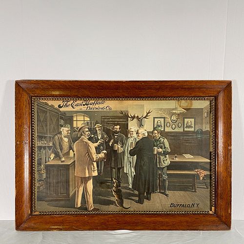 East Bufffalo Brewing Company Framed Advertisement, Charming vintage lithographic print showing a group of men in a bar holding beer steins, with a be