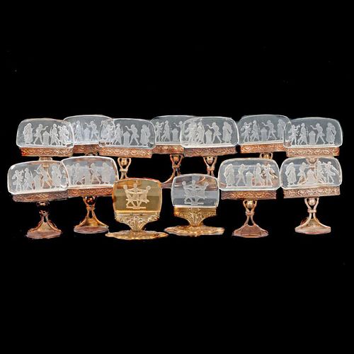 Set of eleven Austrian intaglio glass place card holders, with two similar.