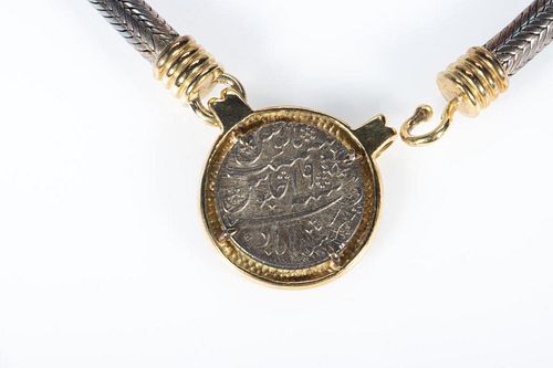 Coin, silver and yellow metal necklace.