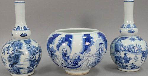 Three blue and white Oriental porcelain pieces to include a pair of double gourd globular vases and a blue and white pot. hts. 6 1/2...