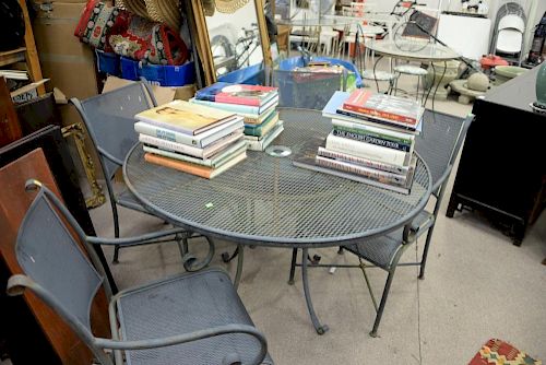Five piece lot including mesh metal table and four armchairs. dia. 48in.