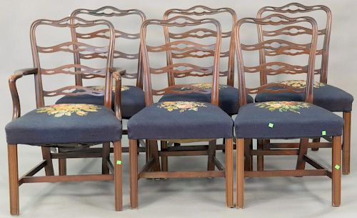 Seven piece mahogany dining set with triple pedestal dining table and six ribbon back Chippendale style chairs with needlepoint seat...