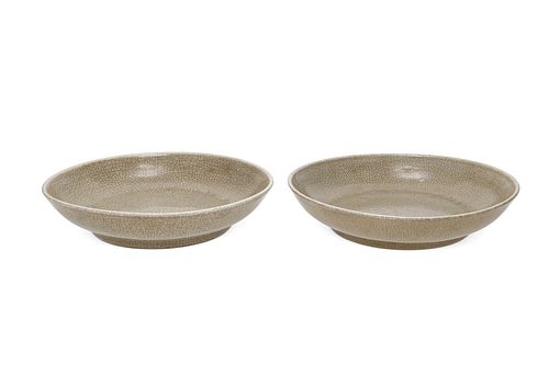 A near-pair of Chinese celadon ceramic plates