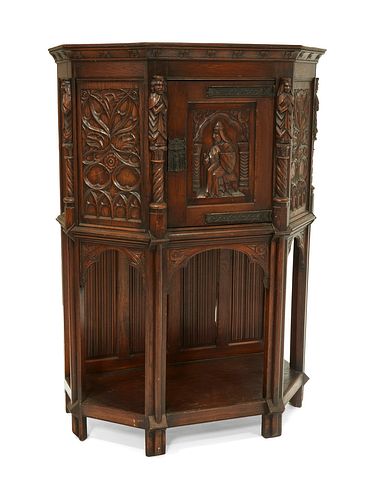 A Gothic Revival carved wood court cupboard