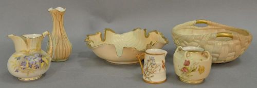 Six pieces of Royal Worcester blush ivory porcelain to include large leaf dish, handled bowl, two vases, and two ewers. ht. 2 1/2in....